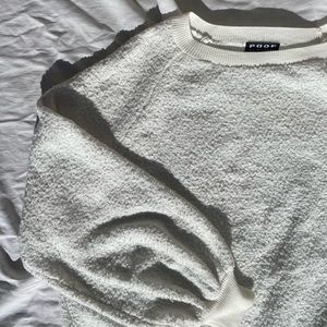 white fuzzy sweater